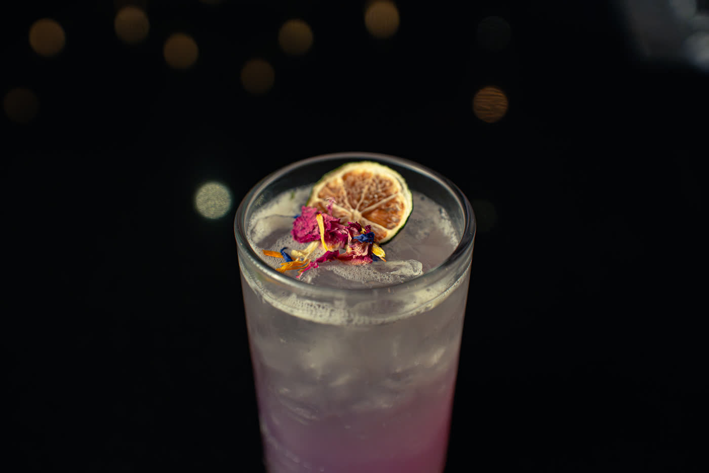 Pink cocktail with dried citrus